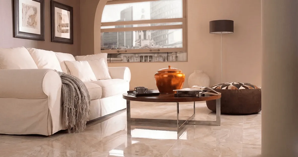 Modern living room with professionally installed marble flooring, a beige sofa, coffee table in Riverside, CA
