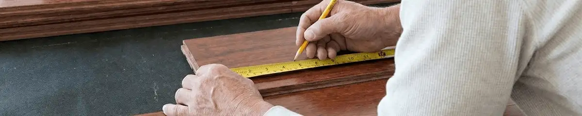 A professional installing wood flooring in Riverside, CA